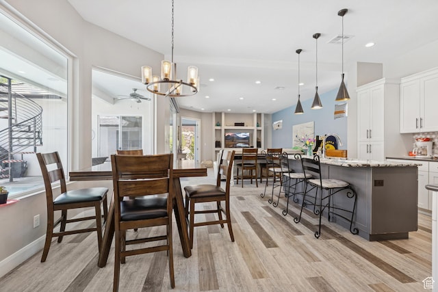 536 N Creek Cir, Washington, UT 84780 - dining area featuring light wood-style flooring, a chandelier, ceiling fan, recessed lighting, and baseboards