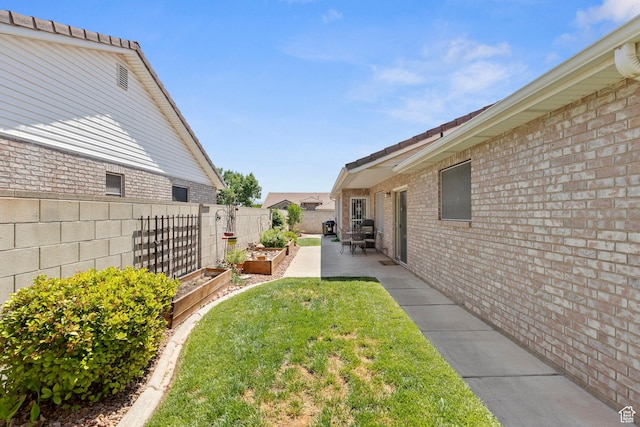 1040 S 1100 E Unit 80, St George, UT 84790 - view of yard with a garden and a patio