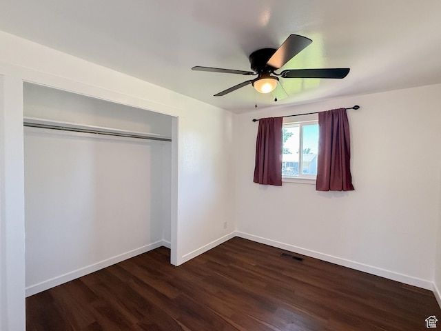 5432 S 800 E, South Ogden, UT 84405 - unfurnished bedroom featuring dark wood-style flooring, baseboards, a closet, and a ceiling fan