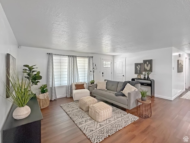 5432 S 800 E, South Ogden, UT 84405 - living area featuring baseboards, dark wood-type flooring, and a textured ceiling