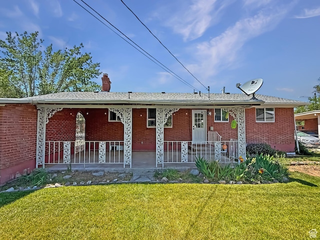 5432 S 800 E, South Ogden, UT 84405 - view of front of property with a front yard, brick siding, and a chimney