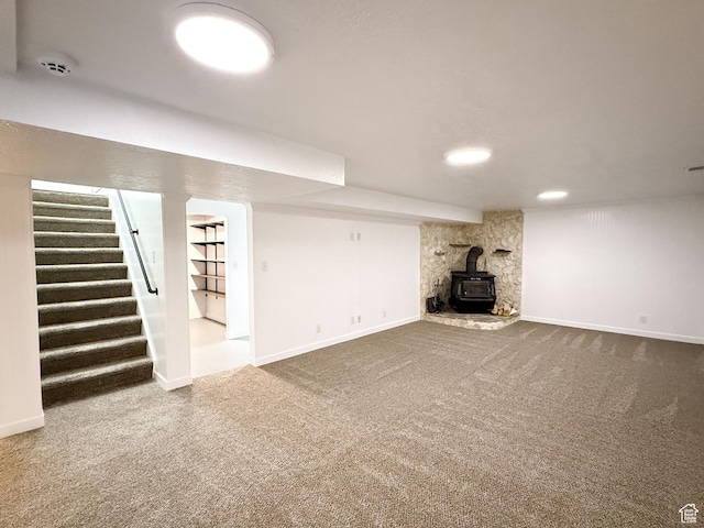 5432 S 800 E, South Ogden, UT 84405 - finished below grade area with carpet flooring, a wood stove, stairs, and baseboards