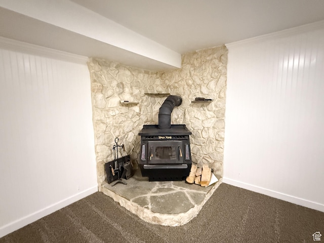 5432 S 800 E, South Ogden, UT 84405 - detailed view of a wood stove, baseboards, and carpet flooring