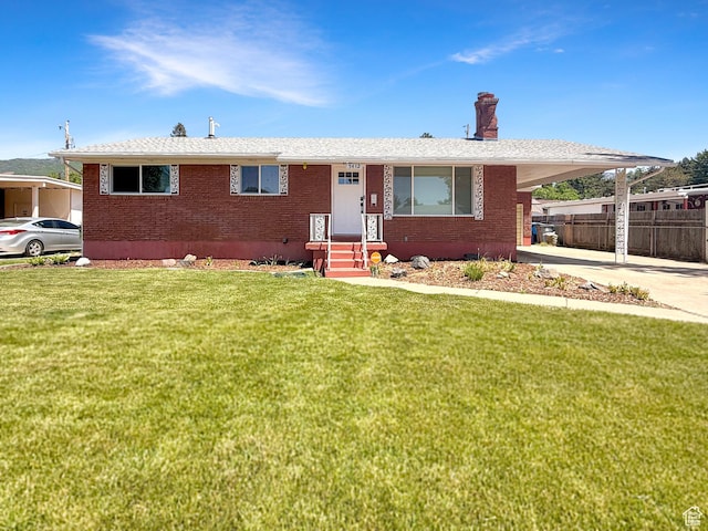 5432 S 800 E, South Ogden, UT 84405 - view of front of house with a chimney, brick siding, a carport, and concrete driveway