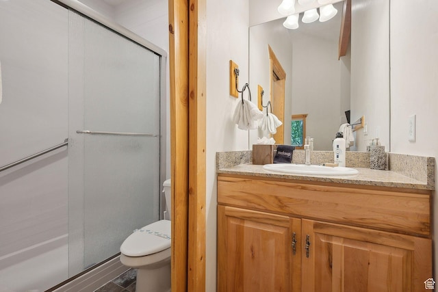 3988 N Timber Wolf Ln Unit 10D, Park City, UT 84098 - bathroom featuring toilet, vanity, and a stall shower