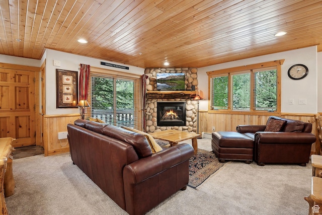 3988 N Timber Wolf Ln Unit 10D, Park City, UT 84098 - carpeted living room with wood ceiling, wainscoting, wooden walls, a fireplace, and healthy amount of natural light