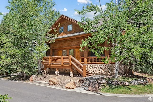 3988 N Timber Wolf Ln Unit 10D, Park City, UT 84098 - view of front facade with covered porch, stairs, and metal roof