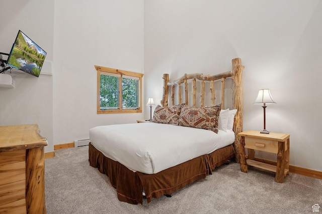 3988 N Timber Wolf Ln Unit 10D, Park City, UT 84098 - bedroom featuring carpet floors, a baseboard heating unit, baseboards, and a towering ceiling