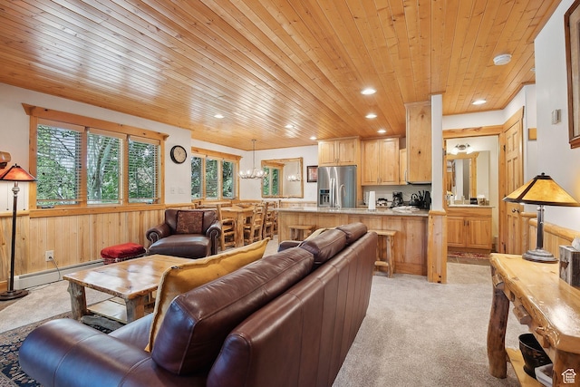 3988 N Timber Wolf Ln Unit 10D, Park City, UT 84098 - living area featuring wooden ceiling, a baseboard heating unit, wainscoting, recessed lighting, and light colored carpet