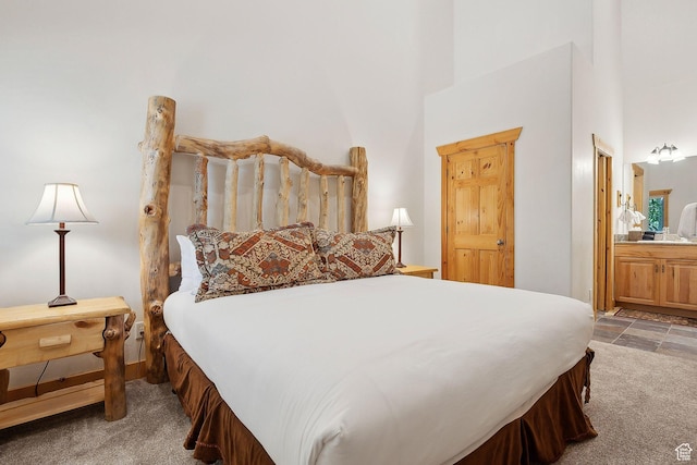3988 N Timber Wolf Ln Unit 10D, Park City, UT 84098 - carpeted bedroom featuring a high ceiling and ensuite bathroom