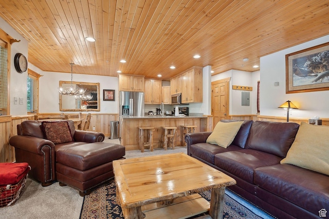 3988 N Timber Wolf Ln Unit 10D, Park City, UT 84098 - living area featuring wooden ceiling, a wainscoted wall, light carpet, a chandelier, and recessed lighting