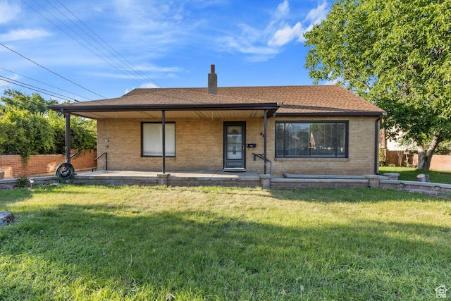 42 W 200 S, Spanish Fork, UT 84660 - view of front of home featuring brick siding, a chimney, a porch, and a shingled roof