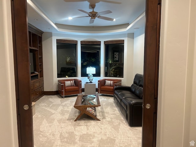 2763 N Chaco Trl, St George, UT 84770 - living area with a ceiling fan, light carpet, and a tray ceiling