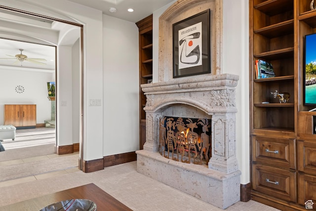 2763 N Chaco Trl, St George, UT 84770 - tiled living area with a warm lit fireplace, a ceiling fan, baseboards, and recessed lighting