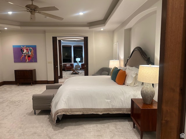 2763 N Chaco Trl, St George, UT 84770 - carpeted bedroom featuring a tray ceiling, recessed lighting, ceiling fan, and baseboards