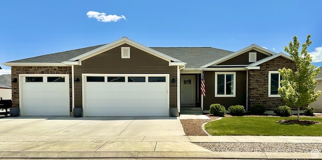 5154 N Blackbrush Dr, Eagle Mountain, UT 84005 - view of front of house featuring an attached garage, driveway, a front lawn, and a shingled roof
