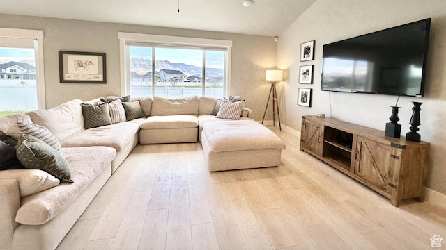 5154 N Blackbrush Dr, Eagle Mountain, UT 84005 - living room featuring light wood finished floors and vaulted ceiling
