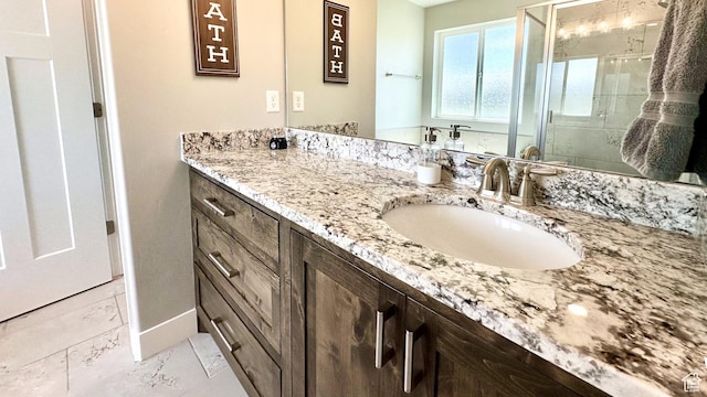 5154 N Blackbrush Dr, Eagle Mountain, UT 84005 - full bath with vanity, a stall shower, and baseboards