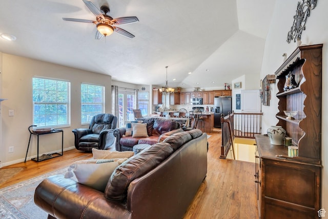 6329 W Basin Ridge Dr, West Valley City, UT 84128 - living area with ceiling fan, vaulted ceiling, a chandelier, light wood finished floors, and recessed lighting