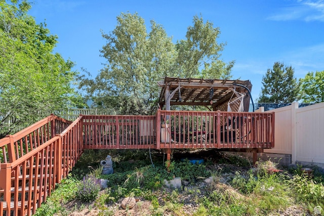 6329 W Basin Ridge Dr, West Valley City, UT 84128 - wooden deck with a pergola and a fenced backyard