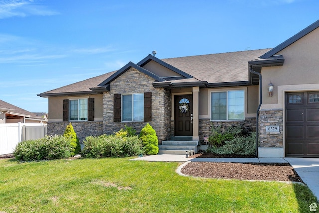 6329 W Basin Ridge Dr, West Valley City, UT 84128 - craftsman-style home featuring stone siding, stucco siding, and a shingled roof