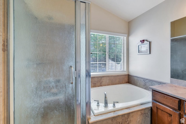 6329 W Basin Ridge Dr, West Valley City, UT 84128 - full bathroom featuring a stall shower, a garden tub, lofted ceiling, and vanity