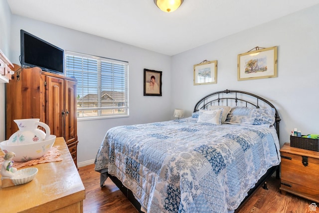 6329 W Basin Ridge Dr, West Valley City, UT 84128 - bedroom featuring wood finished floors and baseboards