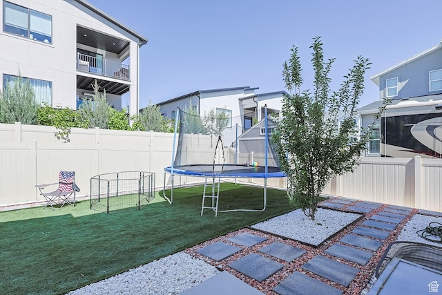 14908 S Fawley Ln, Herriman, UT 84096 - view of yard featuring a trampoline and a patio area