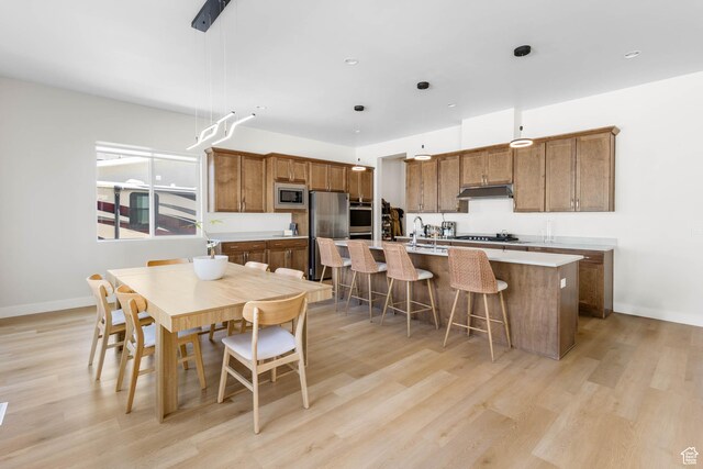 14908 S Fawley Ln, Herriman, UT 84096 - dining room with light wood finished floors and baseboards