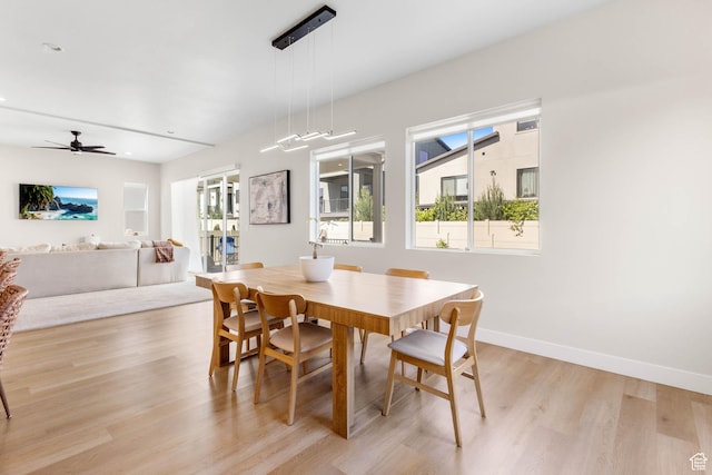 14908 S Fawley Ln, Herriman, UT 84096 - dining area with light wood-style floors, baseboards, and a ceiling fan