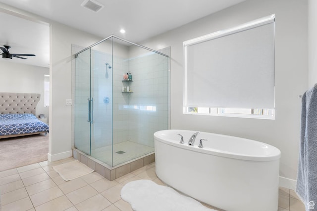 14908 S Fawley Ln, Herriman, UT 84096 - full bathroom featuring a soaking tub, ensuite bath, a shower stall, tile patterned flooring, and baseboards