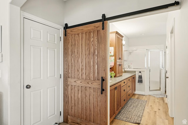 2271 W Crestview Cir, Cedar City, UT 84720 - full bathroom featuring a shower stall, wood finished floors, and double vanity