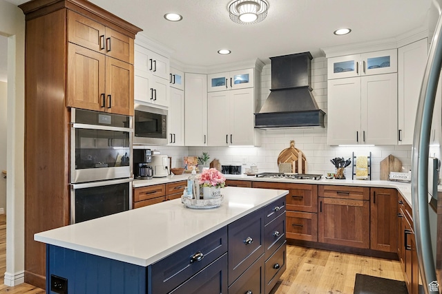 2271 W Crestview Cir, Cedar City, UT 84720 - kitchen with custom exhaust hood, appliances with stainless steel finishes, light wood finished floors, light countertops, and recessed lighting