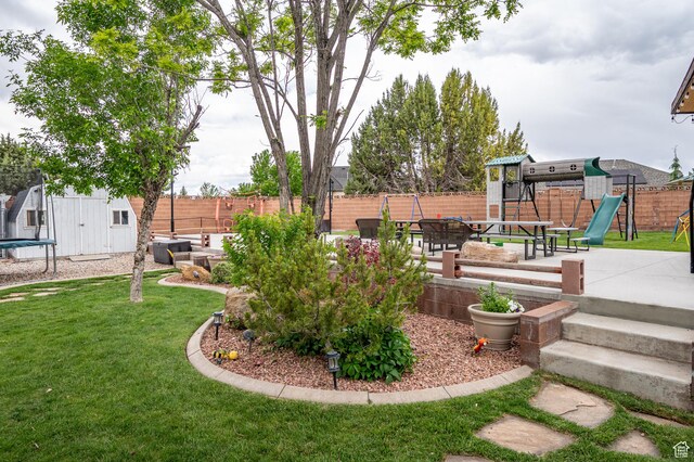 2271 W Crestview Cir, Cedar City, UT 84720 - view of yard with a trampoline, a playground, and a patio