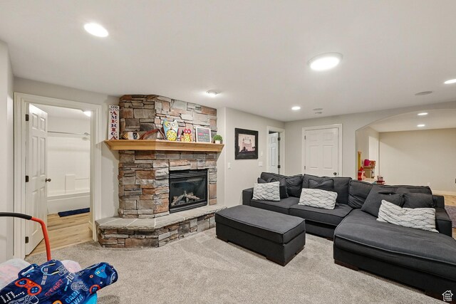 2271 W Crestview Cir, Cedar City, UT 84720 - living room featuring a stone fireplace, arched walkways, and recessed lighting