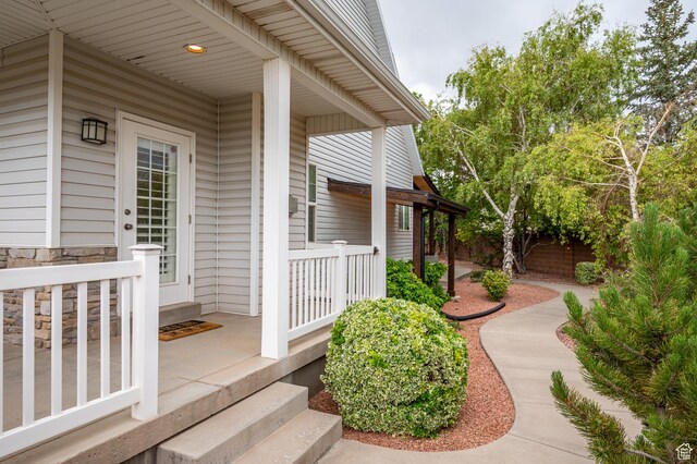 2271 W Crestview Cir, Cedar City, UT 84720 - doorway to property with covered porch and stone siding