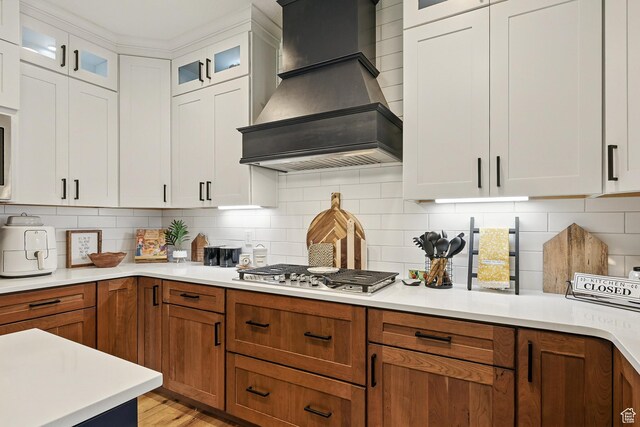 2271 W Crestview Cir, Cedar City, UT 84720 - kitchen featuring premium range hood, stainless steel gas stovetop, light countertops, and backsplash