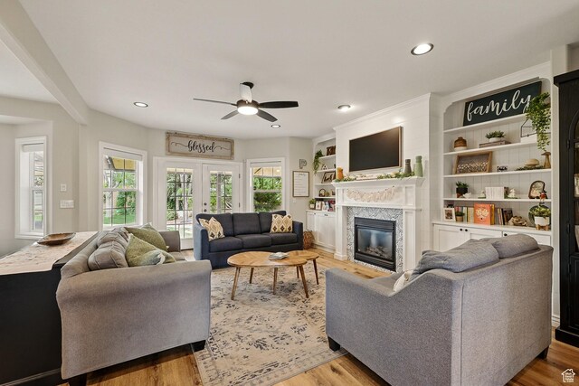 2271 W Crestview Cir, Cedar City, UT 84720 - living area featuring ceiling fan, a glass covered fireplace, wood finished floors, and recessed lighting