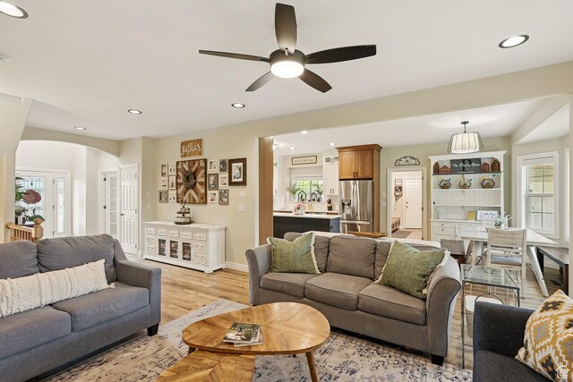 2271 W Crestview Cir, Cedar City, UT 84720 - living area featuring arched walkways, a ceiling fan, recessed lighting, light wood finished floors, and baseboards