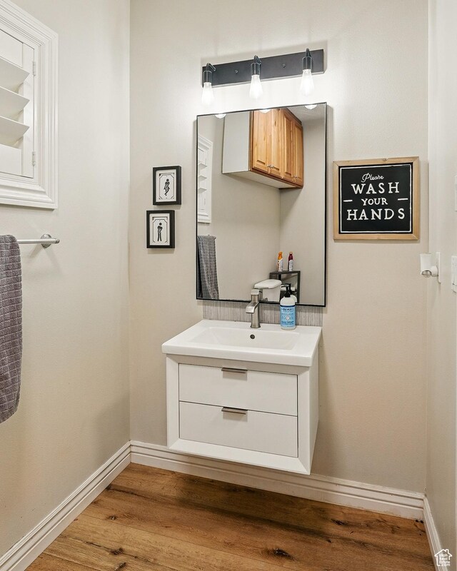 2271 W Crestview Cir, Cedar City, UT 84720 - bathroom with vanity, wood finished floors, and baseboards
