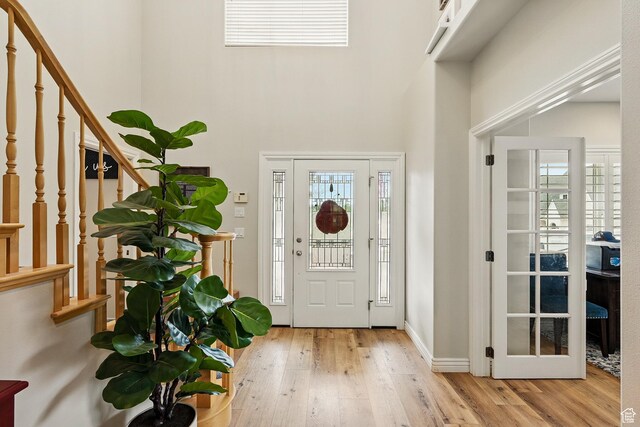 2271 W Crestview Cir, Cedar City, UT 84720 - foyer with a towering ceiling, stairway, wood-type flooring, and baseboards