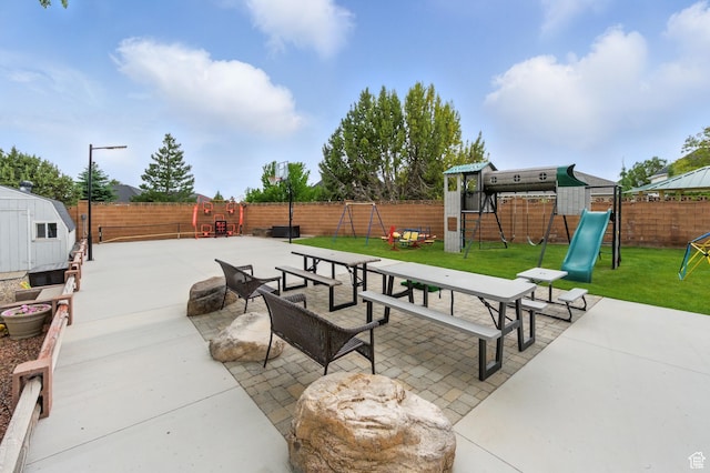 2271 W Crestview Cir, Cedar City, UT 84720 - view of patio featuring a playground and a shed
