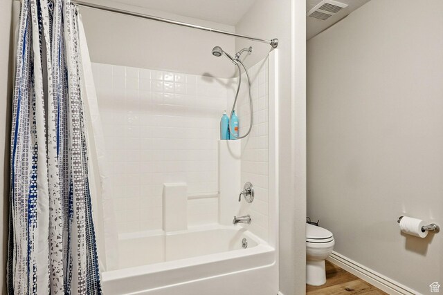 2271 W Crestview Cir, Cedar City, UT 84720 - bathroom featuring shower / bath combination with curtain, toilet, baseboards, and wood finished floors