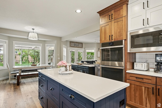 2271 W Crestview Cir, Cedar City, UT 84720 - kitchen featuring built in microwave, stainless steel double oven, recessed lighting, light countertops, and tasteful backsplash