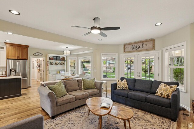 2271 W Crestview Cir, Cedar City, UT 84720 - living room featuring light wood-style flooring, recessed lighting, baseboards, a ceiling fan, and healthy amount of natural light
