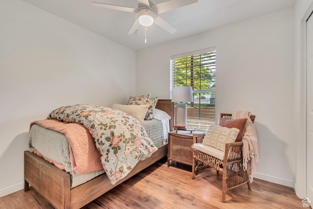 1030 S Orem Blvd Unit 23, Orem, UT 84058 - bedroom with wood finished floors, baseboards, and a ceiling fan