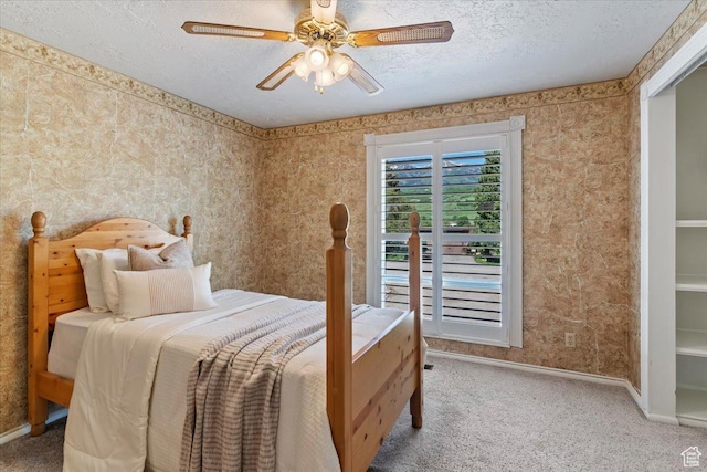 4456 N 3800 W, Peterson, UT 84050 - carpeted bedroom featuring baseboards, a textured ceiling, and a ceiling fan