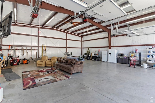 4456 N 3800 W, Peterson, UT 84050 - garage with freestanding refrigerator, white refrigerator with ice dispenser, and a garage door opener