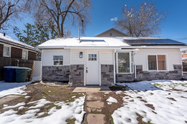 2202 S Lake St, South Salt Lake, UT 84106 - view of front of home with stone siding and roof mounted solar panels