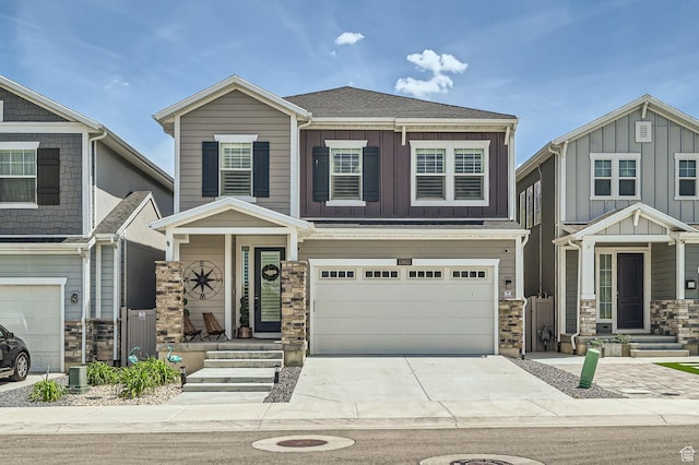 13883 S Rockwell Ln, Draper Ut Cnty, UT 84020 - craftsman-style house with stone siding, a garage, concrete driveway, and board and batten siding